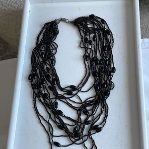 Multi stranded, beaded, fun, fashion, necklace. Makes a statement.